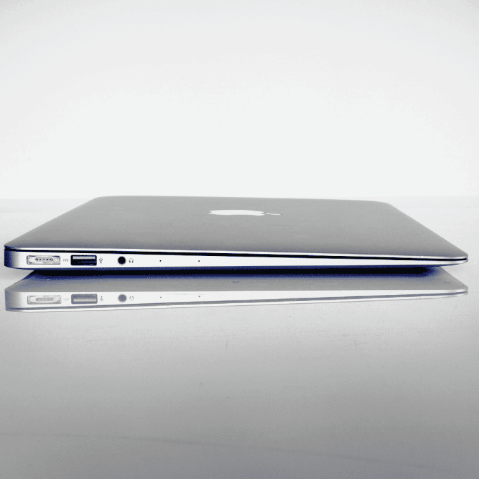 A closed macbook air with a white and grey background. » admin by request