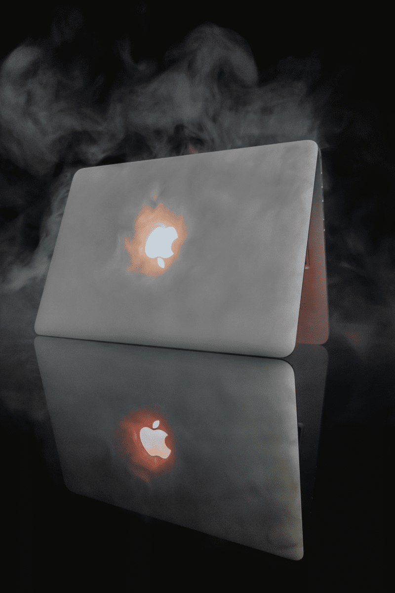 A smoking macbook with a lit orange led apple logo. » admin by request » admin by request