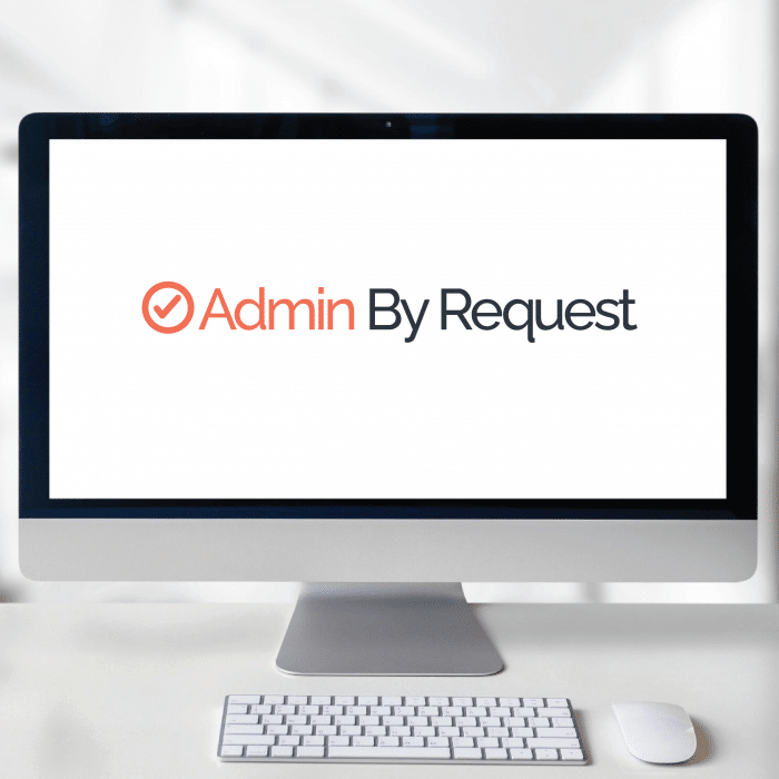 Desktop in a bright room with the admin by request logo on the screen » admin by request